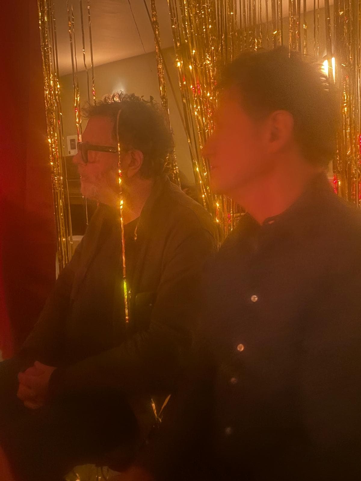 Guests enjoying the warm atmosphere of the evening